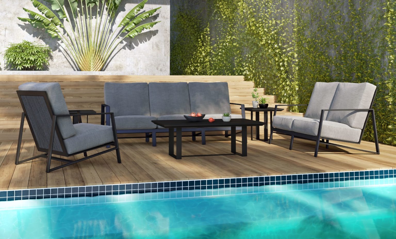 A Castelle outdoor patio furniture set that's set up on a wooden surface next to a pool and walls on the right and behind covered in plants and vines